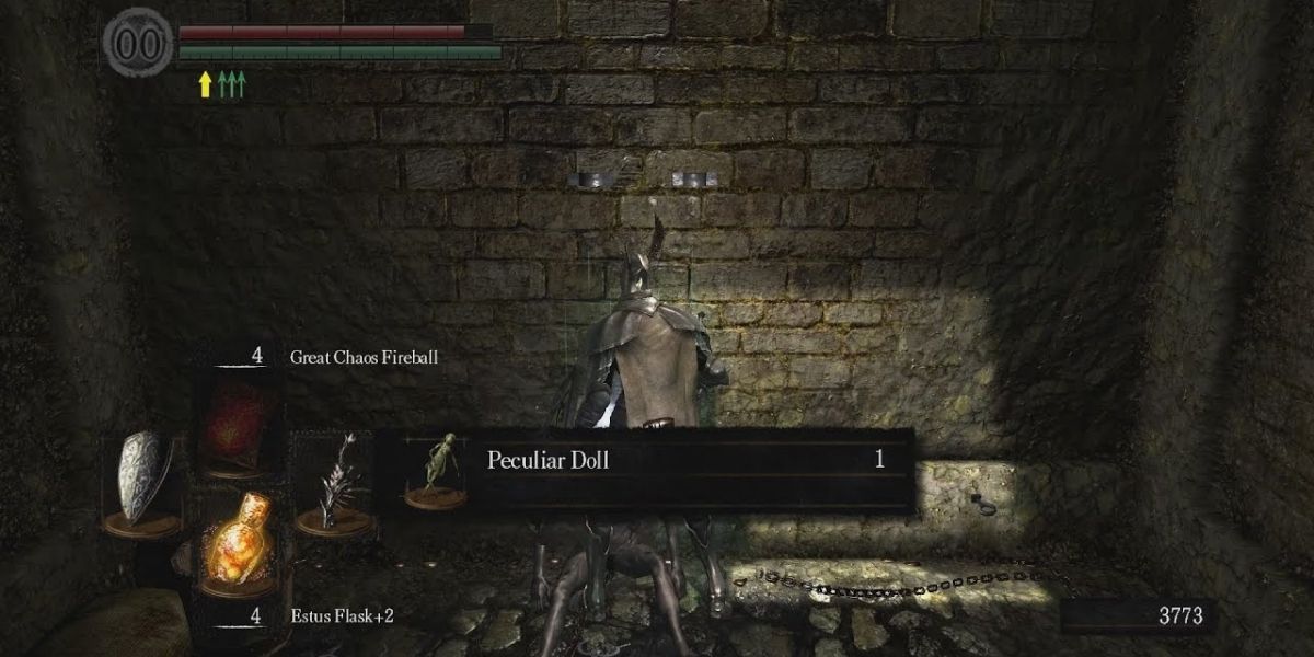 Dark Souls player picking up peculiar doll in asylum cell