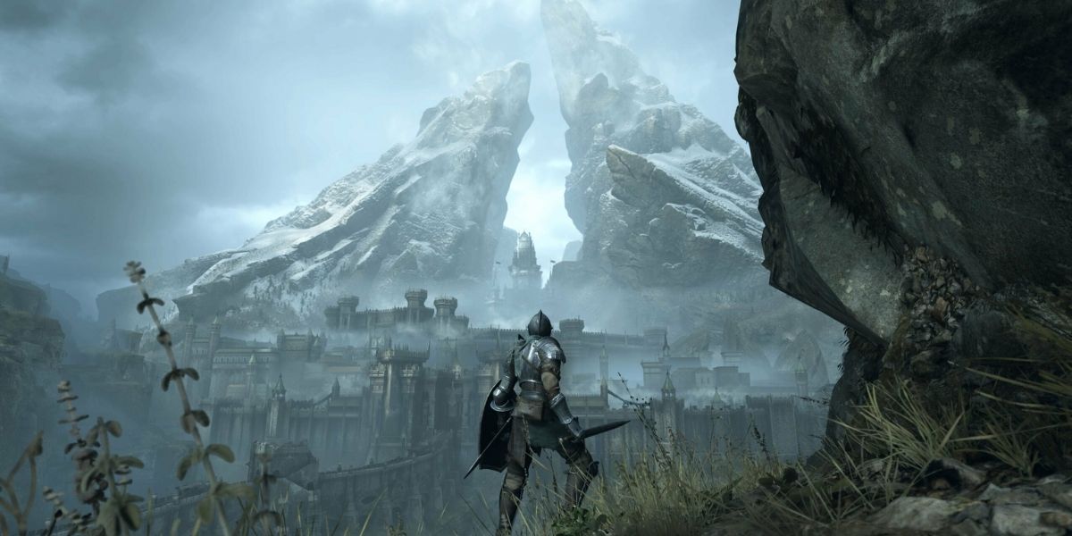 Demon's Souls player standing in front of mountains