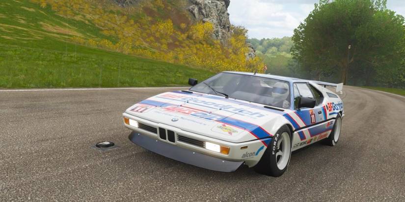 Forza Horizon 4 BMW M1 race car speeding across prairie road
