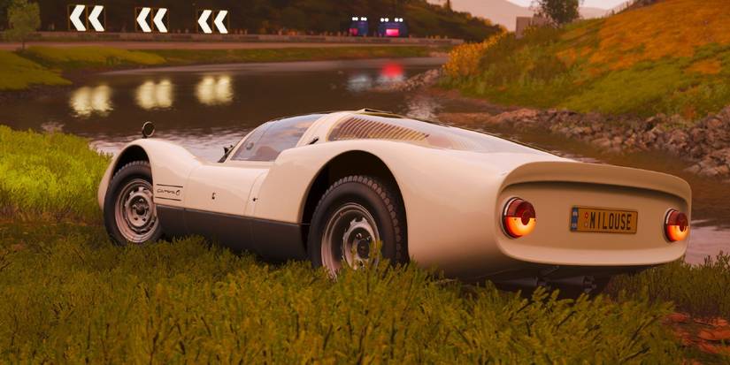 Forza Horizon 4 Porsche 906 Carrera 6 rounding bend in wet grassy field