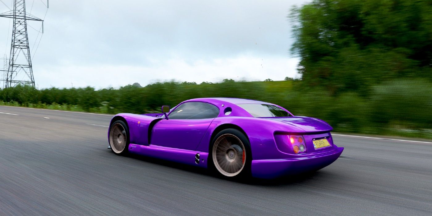 Forza Horizon 4 purple TVR Cerbera Speed 12 side view speeding across woodland road