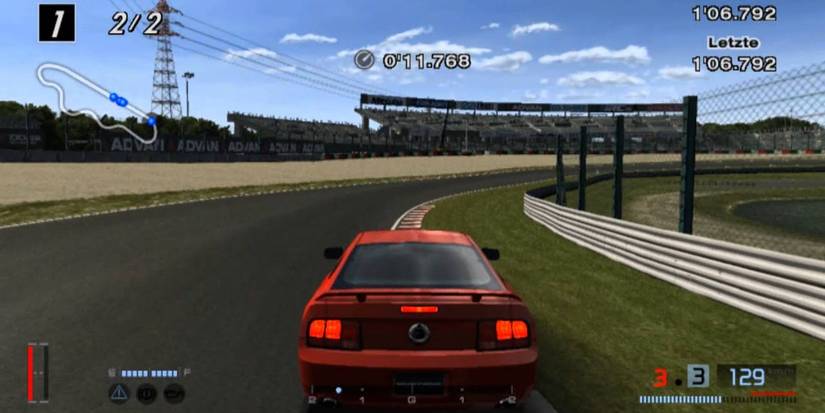 Driving around turn of rally race track in Gran Turismo 4 PS2