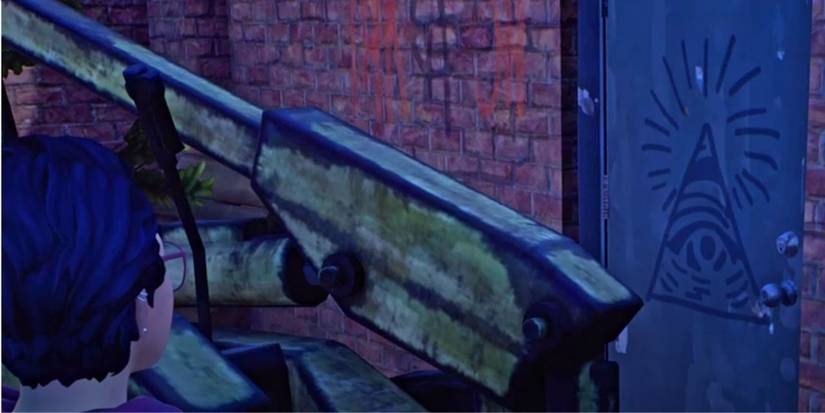 A picture of the illuminati triangle spray painted on a door 