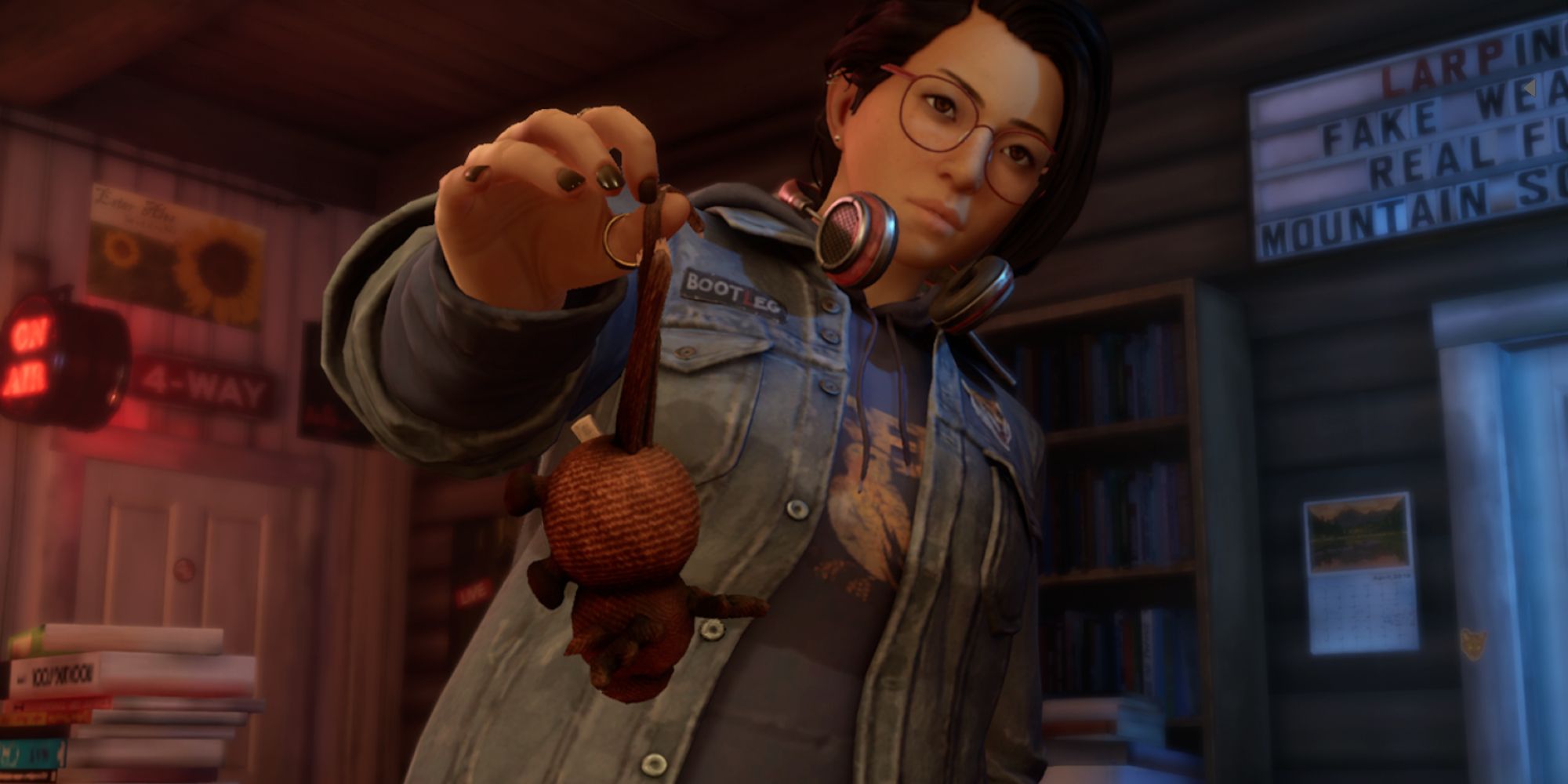 Life is Strange True Colors Screenshot Of Alex Holding Toy Mouse