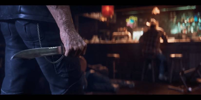 Man with knife walking towards Wolverine