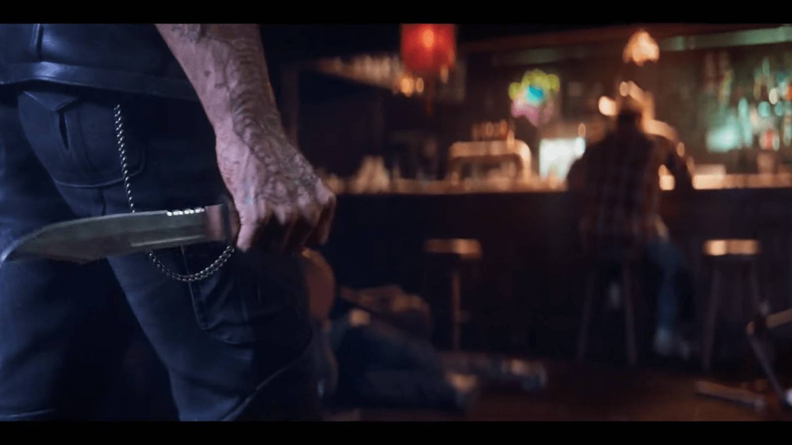 Man with knife walking towards Wolverine