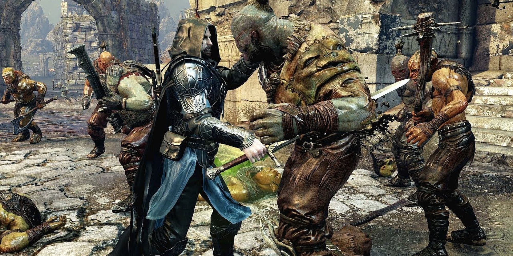 Middle-Earth Shadow of War Talion stabbing an Orc in the middle of a melee Cropped