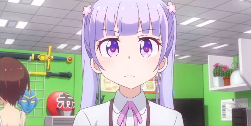 Aoba from New Game! standing in a cubicle with prop weapons on the wall