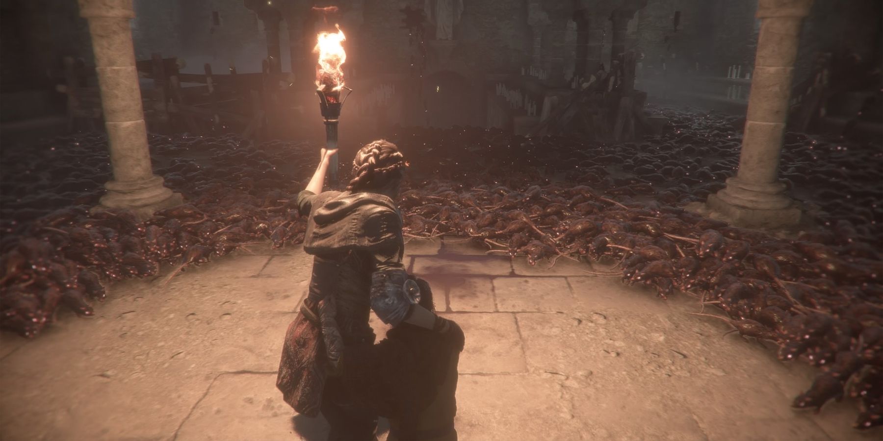 Plague Tale Innocence standing in a horde of rats