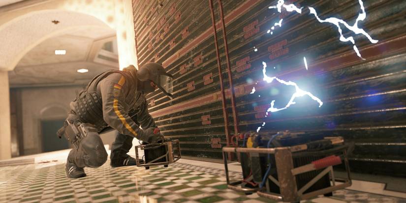 Rainbow Six Siege player placing a gadget 