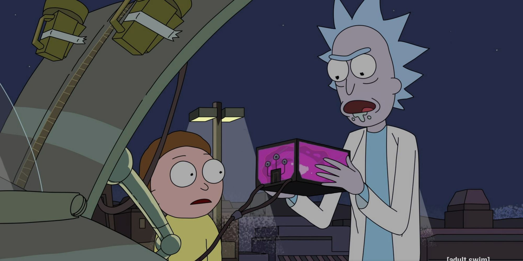 Rick holds up the microverse battery to his space cruiser while Morty looks on in Rick and Morty