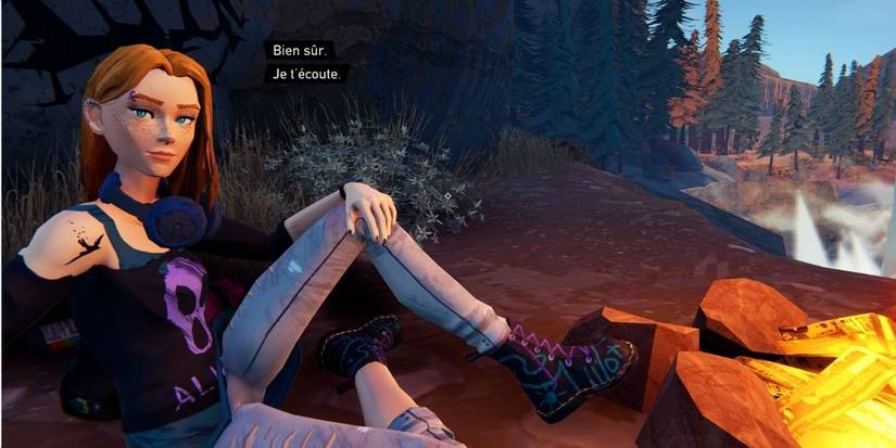 A picture of a woman sat by a bonfire