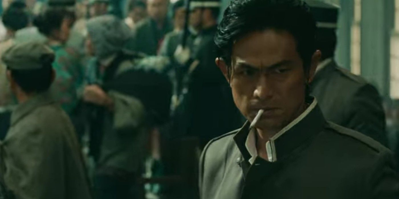 Rurouni Kenshin shot of Hajime Saito smoking a cigarette while standing on a train platform