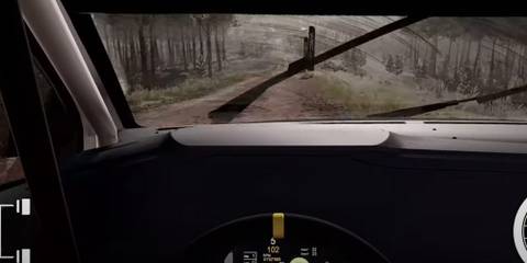 WRC-10 cockpit view of player going down a dirt road