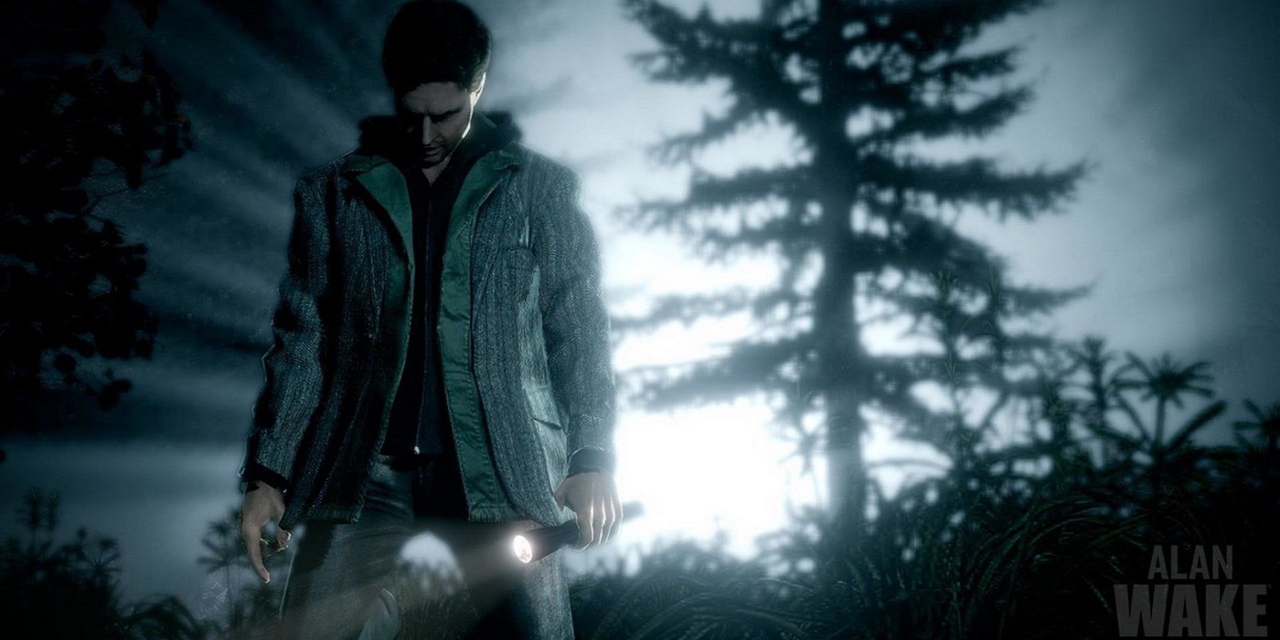 Image from Alan Wake showing the titular character in the foreground as a light shines behind him.