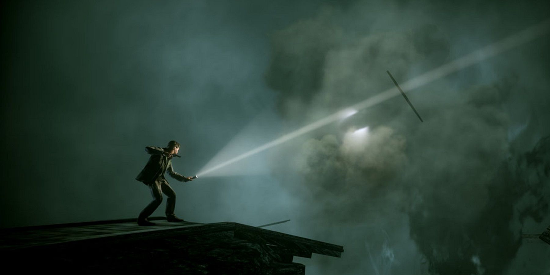 An image from Alan Wake showing the titular character approaching a broken train track.