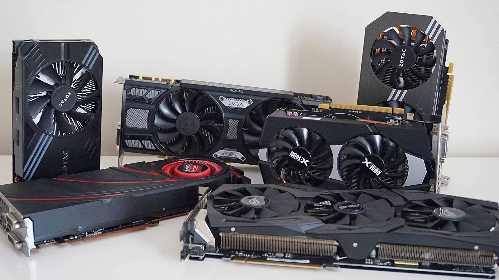 A photo showing a series of Nvidia and AMD graphics cards on a white table.