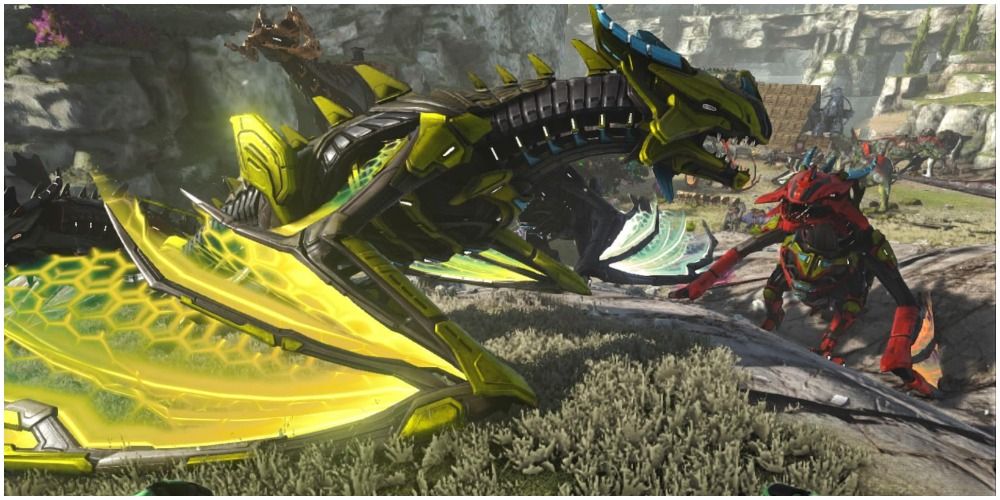 ark survival evolved yellow and red voidwyrms on the ground