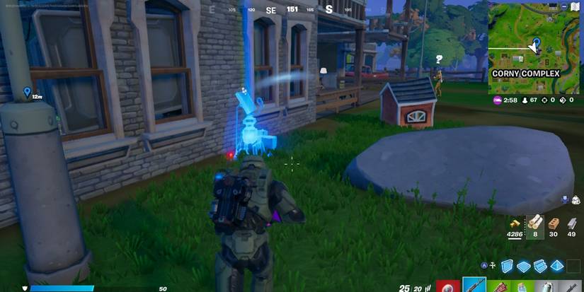 fortnite master chief with mission kit outside farmhouse