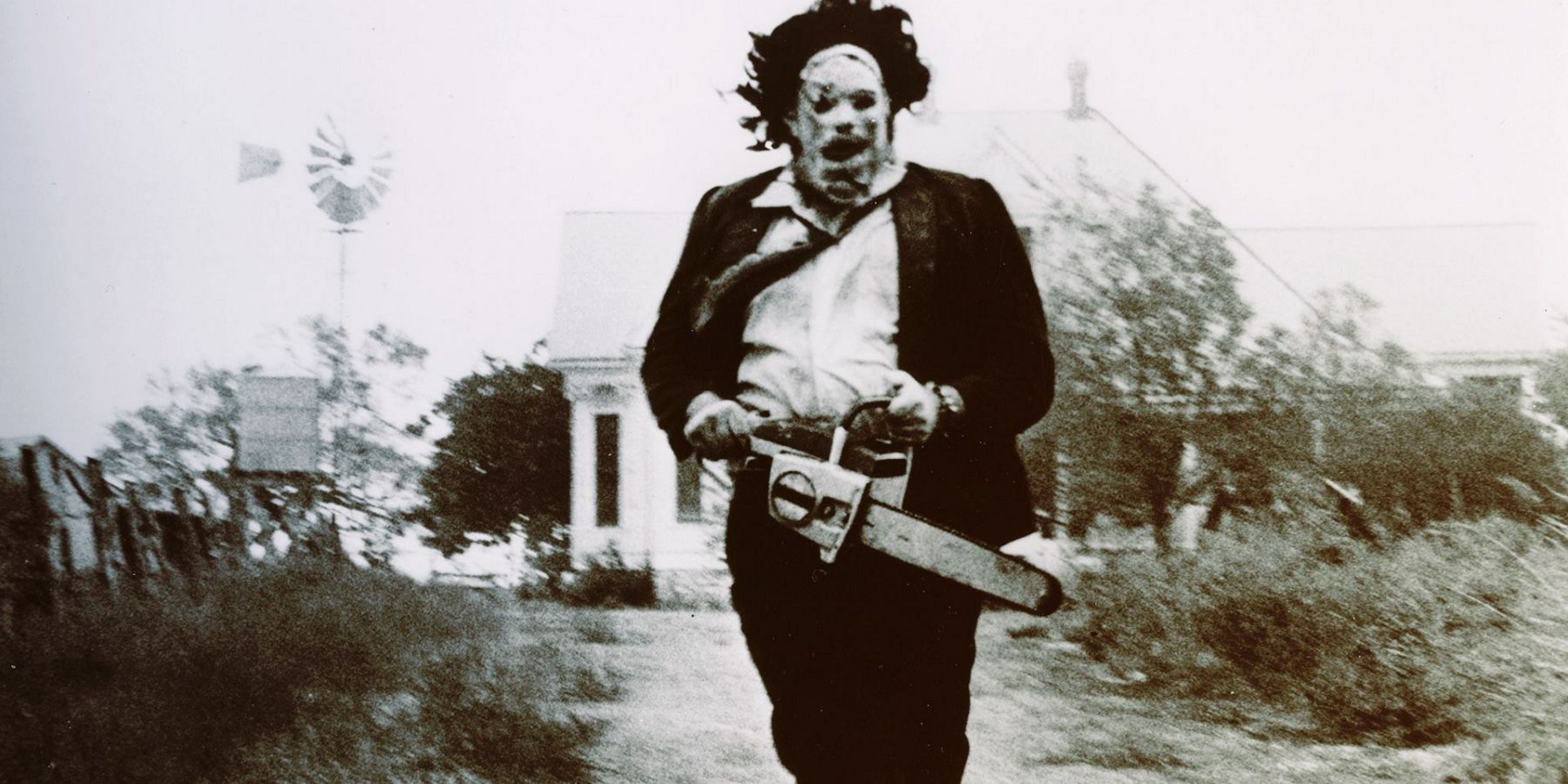 Leatherface running with his saw in The Texas Chain Saw Massacre