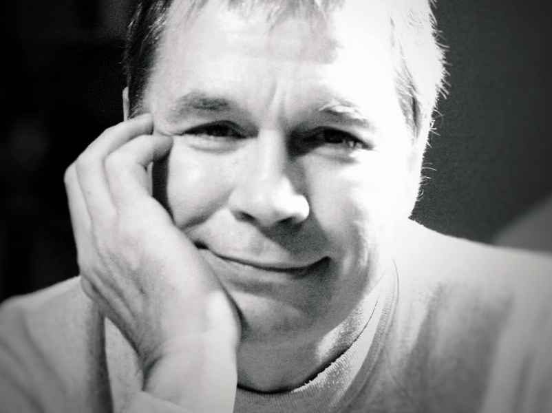 Black and white photo of artist Mick McGinty.