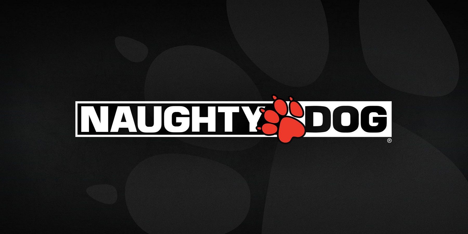 The Naughty Dog logo on a black background with a grey paw behind it.