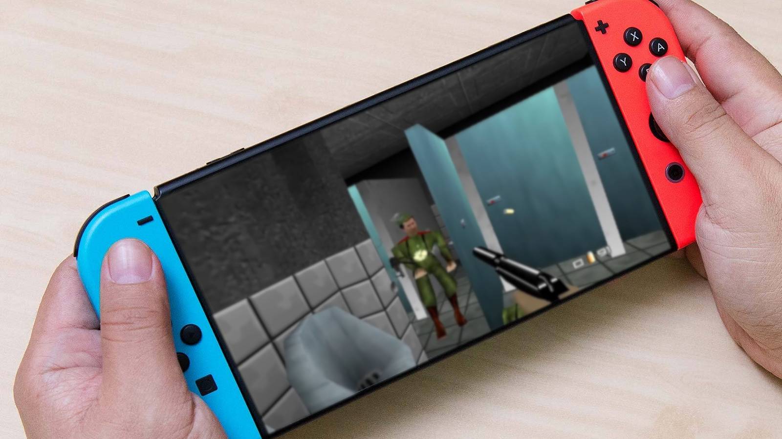 Photo of a Nintendo Switch console with a screenshot from Goldeneye 64 superimposed onto the screen.