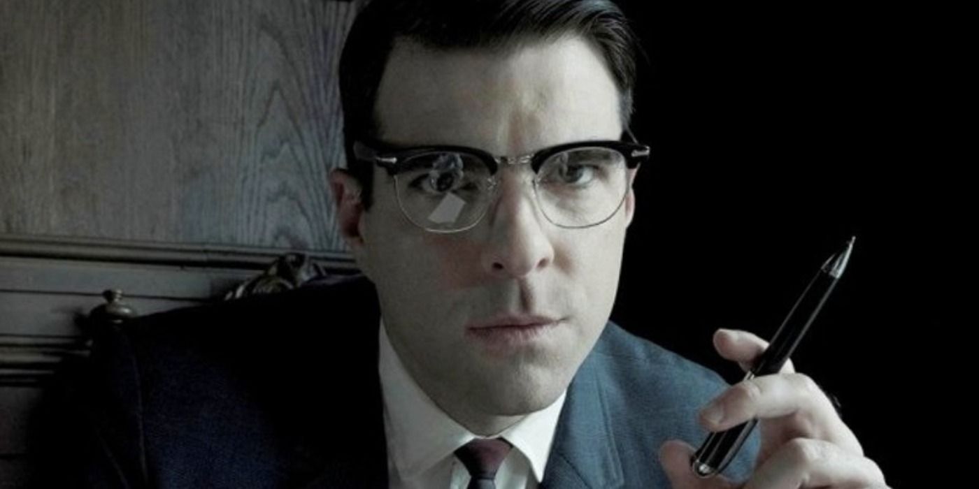 Dr. Oliver Thredson holds a pen in American Horror Story