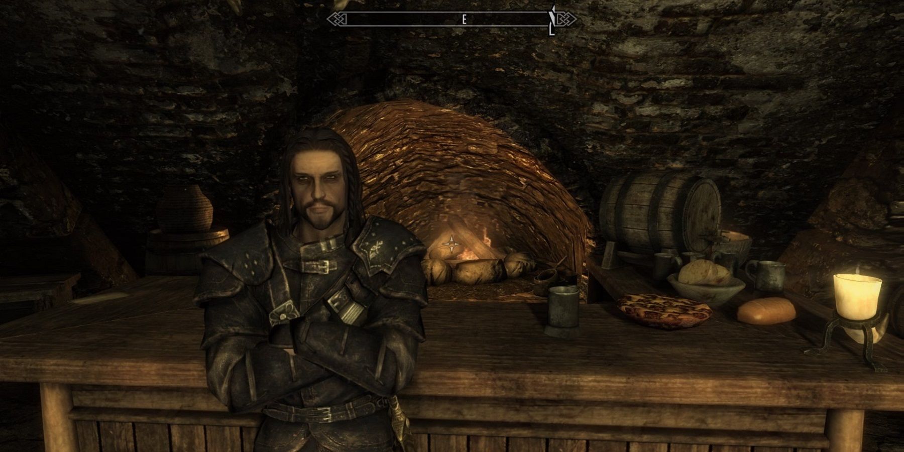 Screenshot from Skyrim showing a thief leaning against a bar in the Thieve's Den.