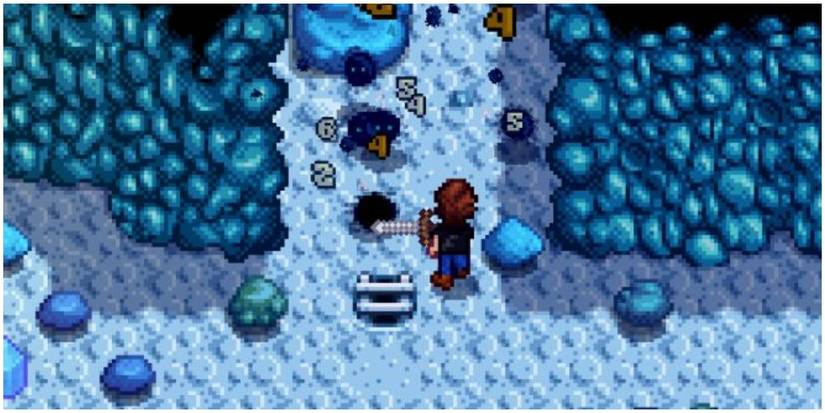 stardew valley player fighting multiple slimes at once