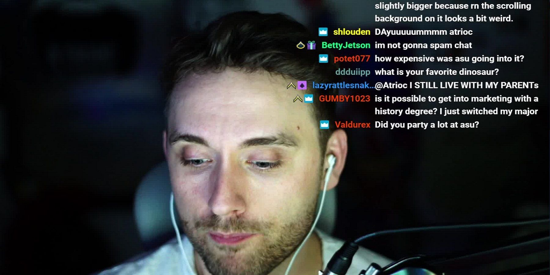 A photo of Twitch streamer Atrioc with chat comments in the top corner.