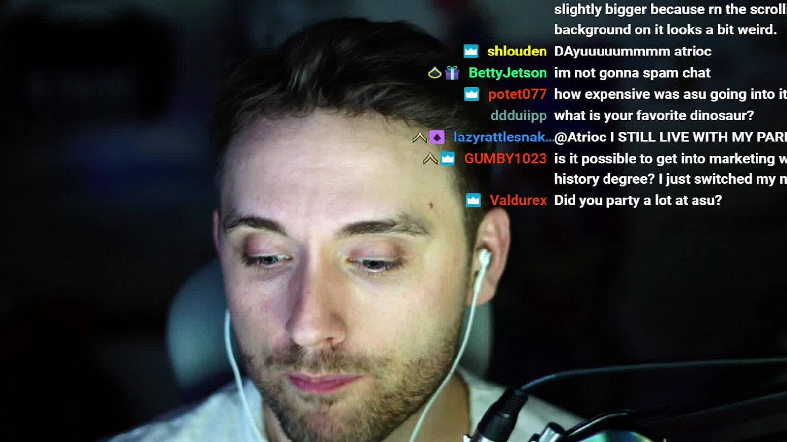 A photo of Twitch streamer Atrioc with chat comments in the top corner.