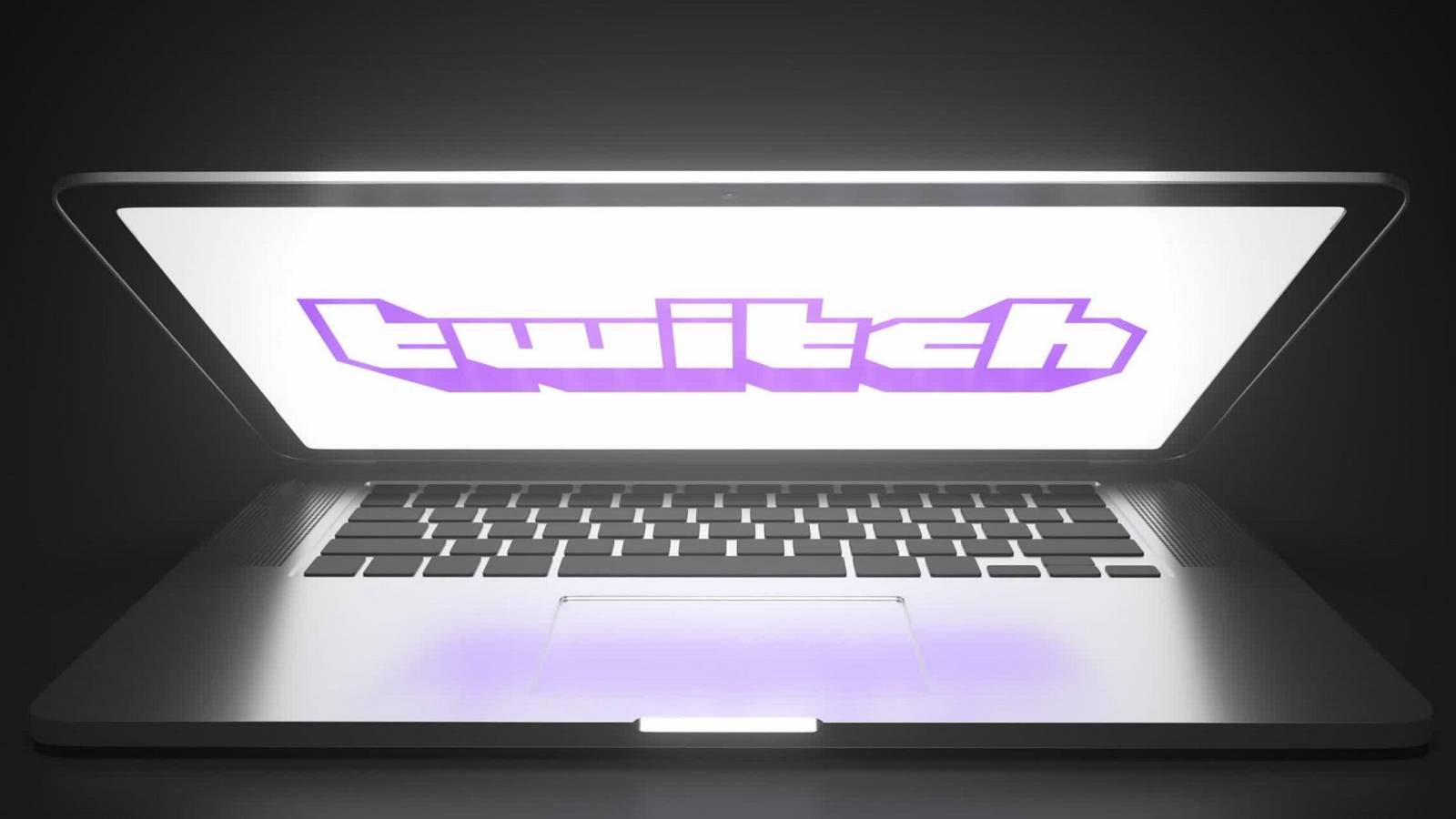 A photo of a half-closed laptop with the Twitch logo on the screen.