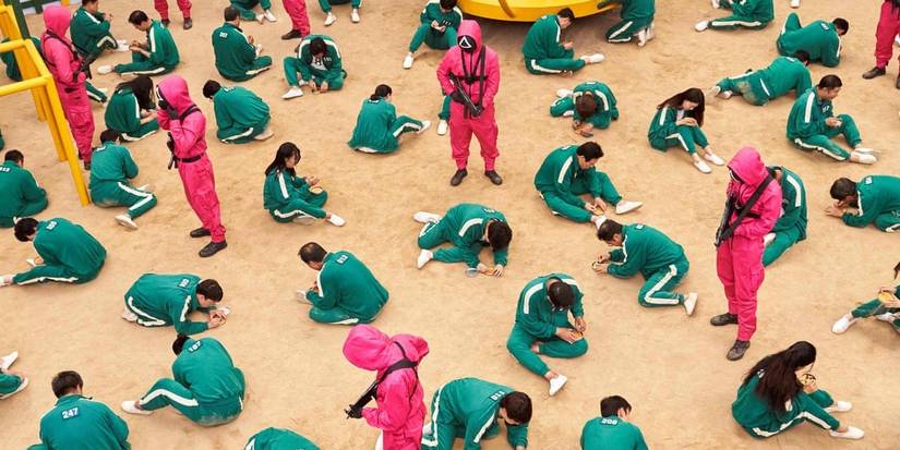 Players sitting on playground floor.