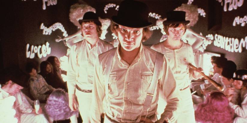 A Clockwork Orange cast in hats looking on