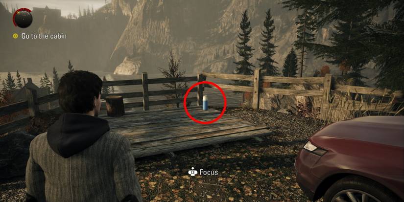 Alan Wake Remastered circled collectible at bird leg cabin cliffside