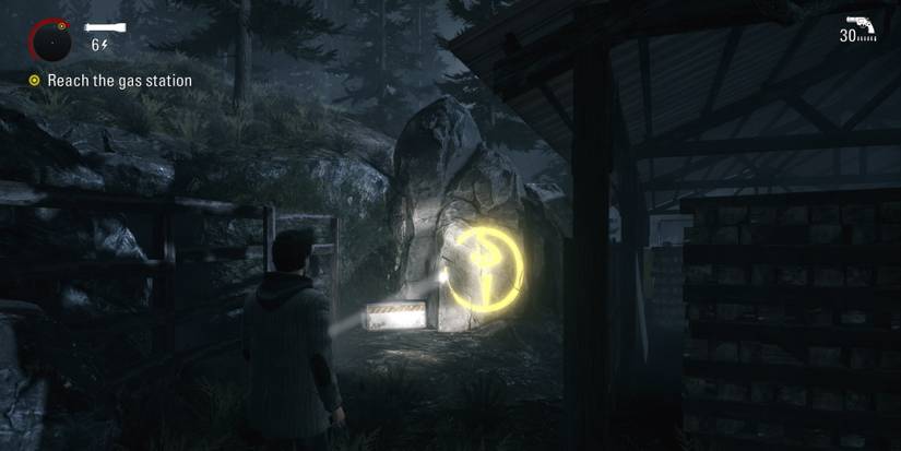 Alan Wake Remastered collectible and flare gun on the path to the gas station