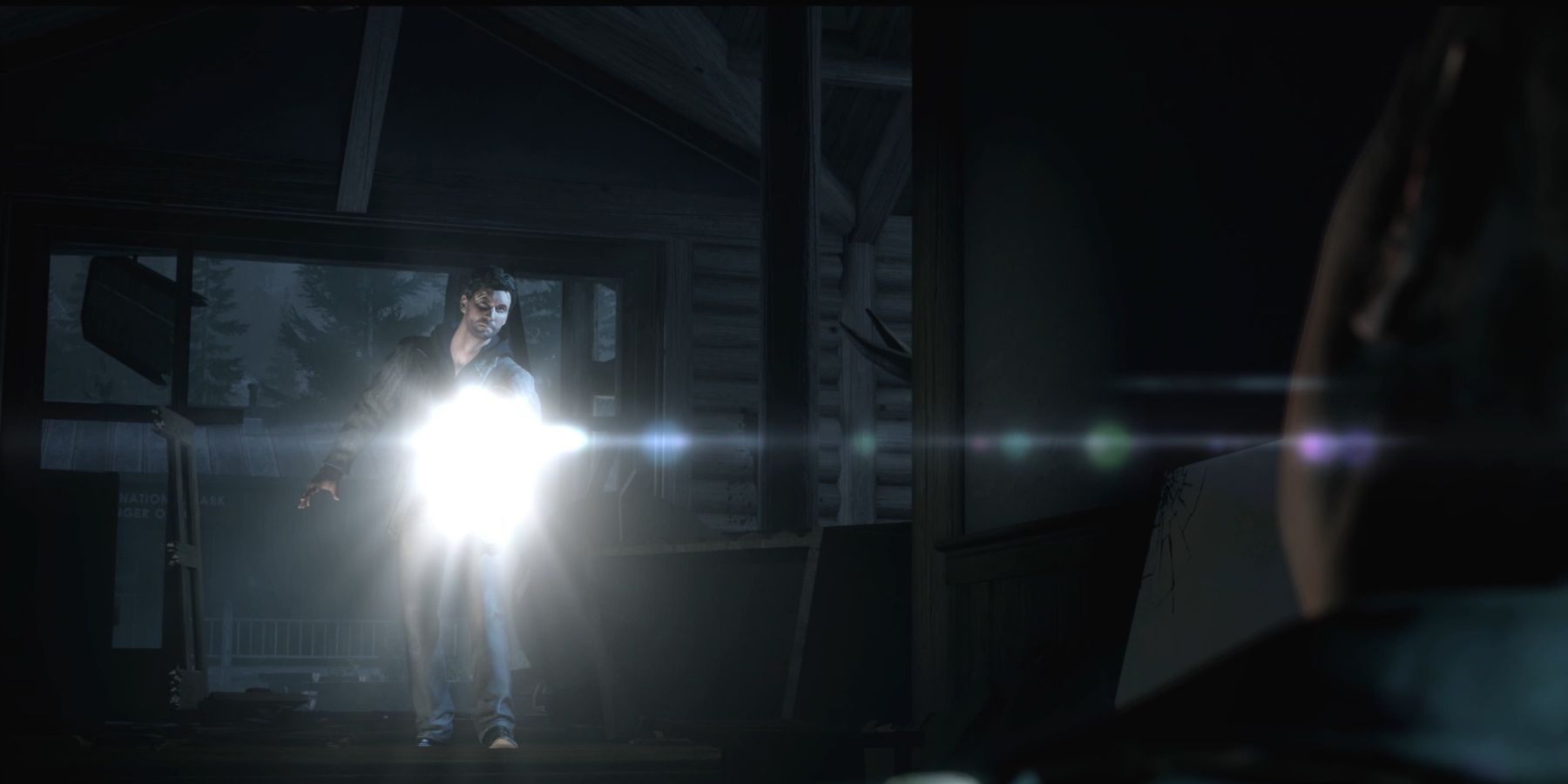 Alan Wake Remastered visitor centre alan with flashlight and rusty injured