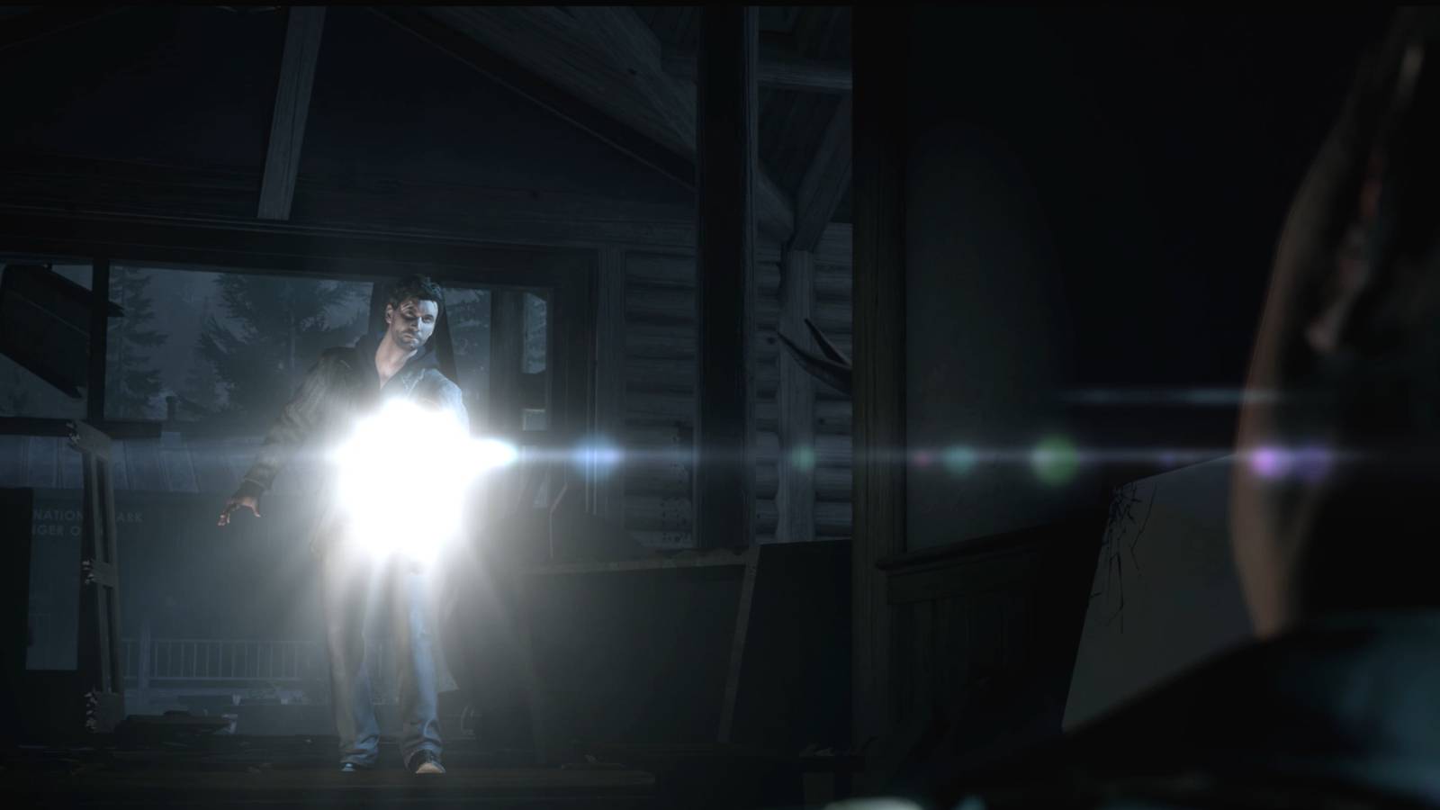 Alan Wake Remastered visitor centre alan with flashlight and rusty injured