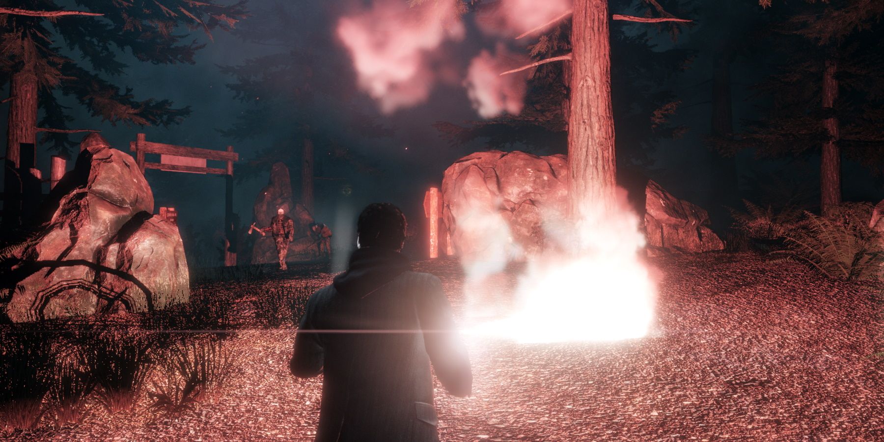 Alan Wake Remastered using flares on hordes of enemies