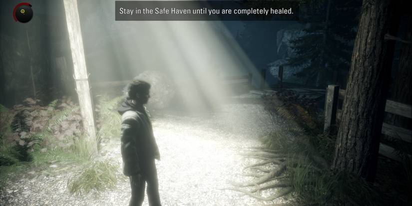 Alan Wake healing under a streetlight in the light