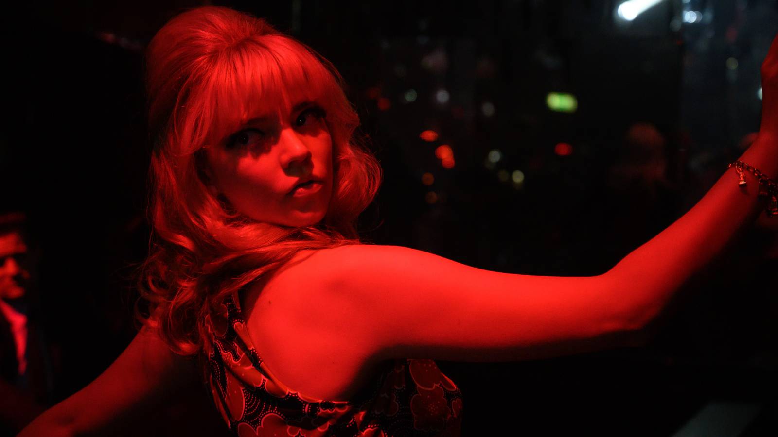Anya Taylor-Joy draped in red light in Last Night in Soho