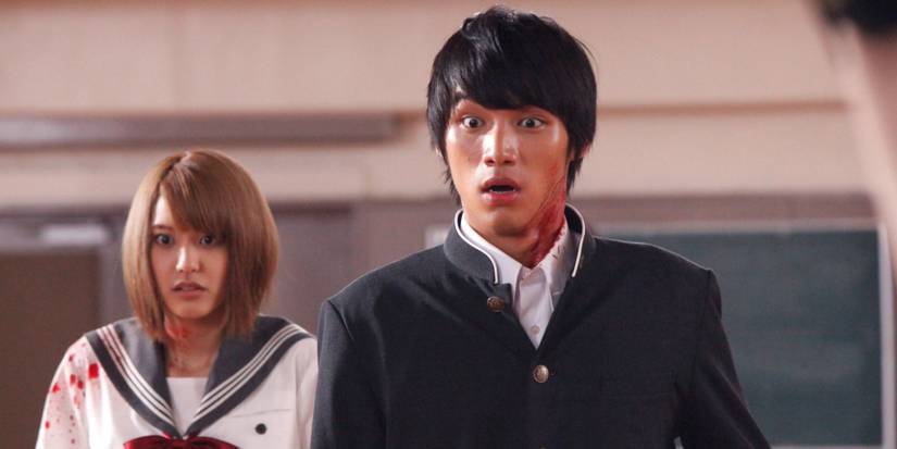 Two shocked teens, splattered with blood in As The Gods Will