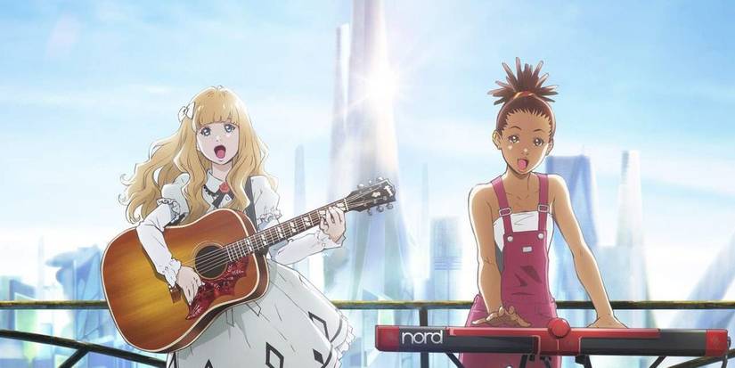 Carole with a guitar & Tuesday with a keyboard, performing together