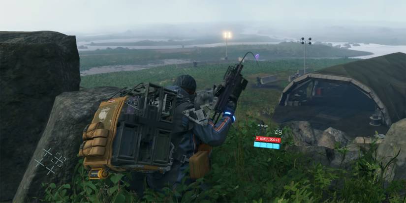 Death Stranding - Sam Using The Sticky Gun To Pull Cargo To Him From Very Far Away