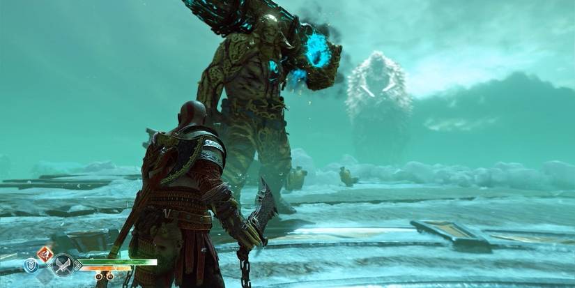 Kratos fighting a troll in God of War