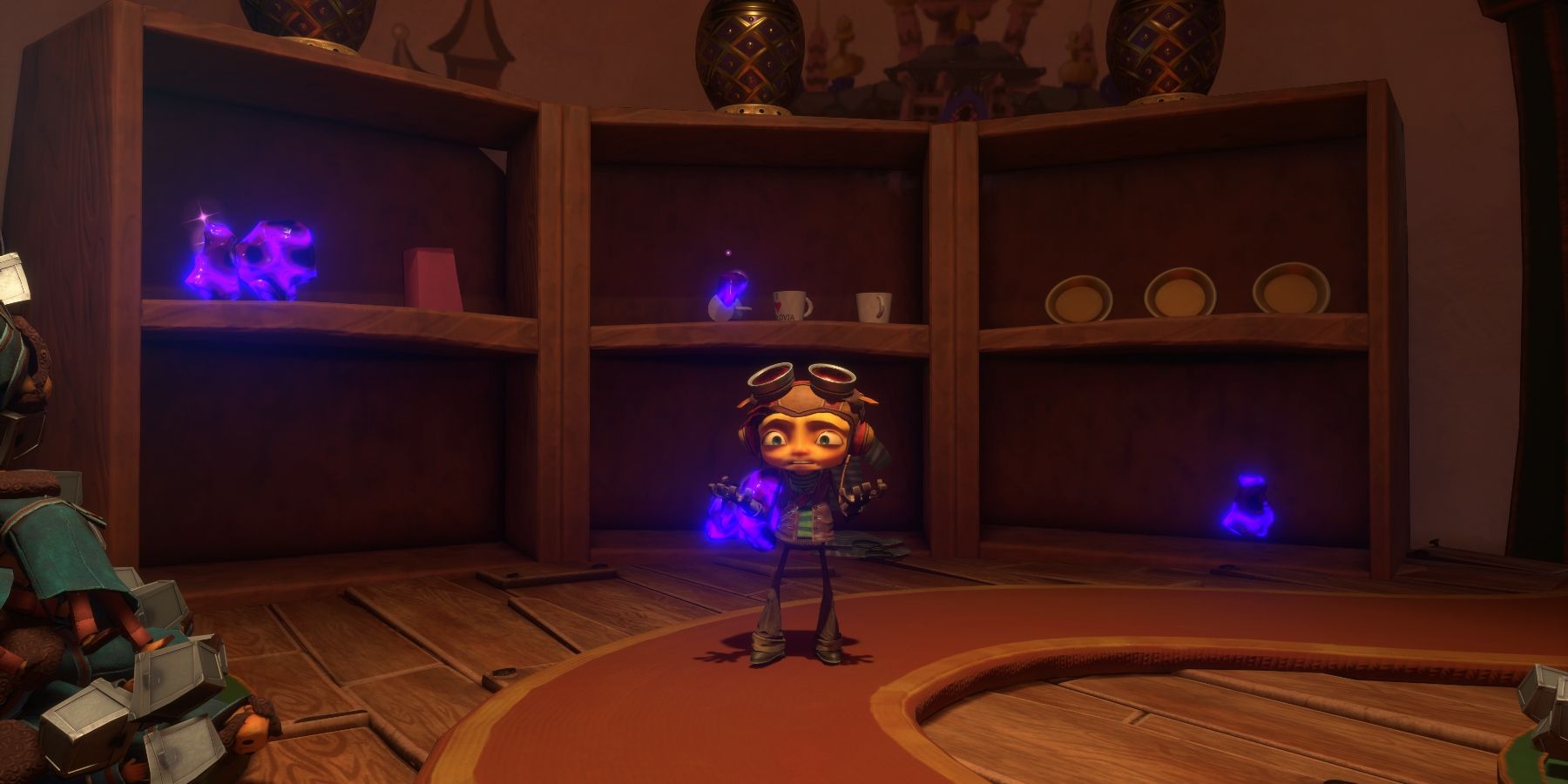 A boy shrugs in confusion in front of a cabinet filled with glowing purple rocks