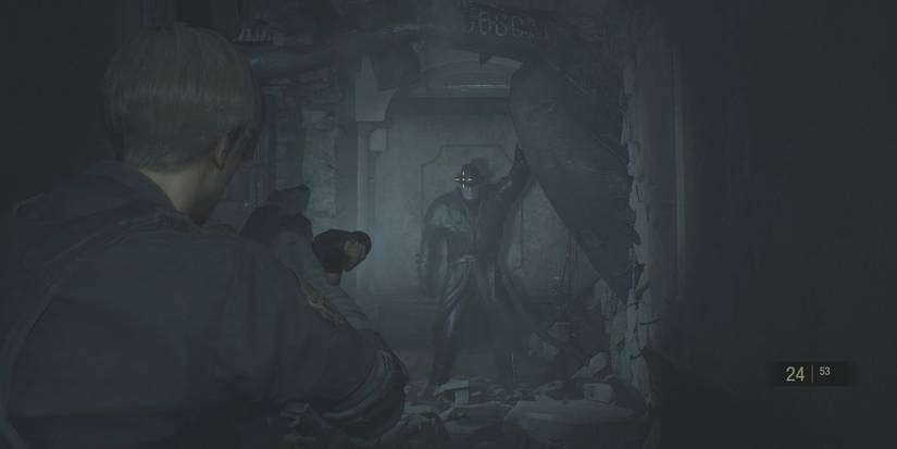 Leon pointing gun at Mr. X.