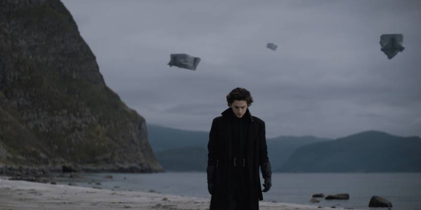 Paul with spaceships behind him in Dune