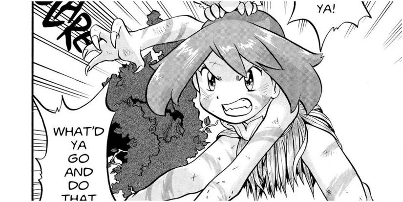 Pokemon Adventures Sapphire crouching down covered in dirt and wearing leaves and grass